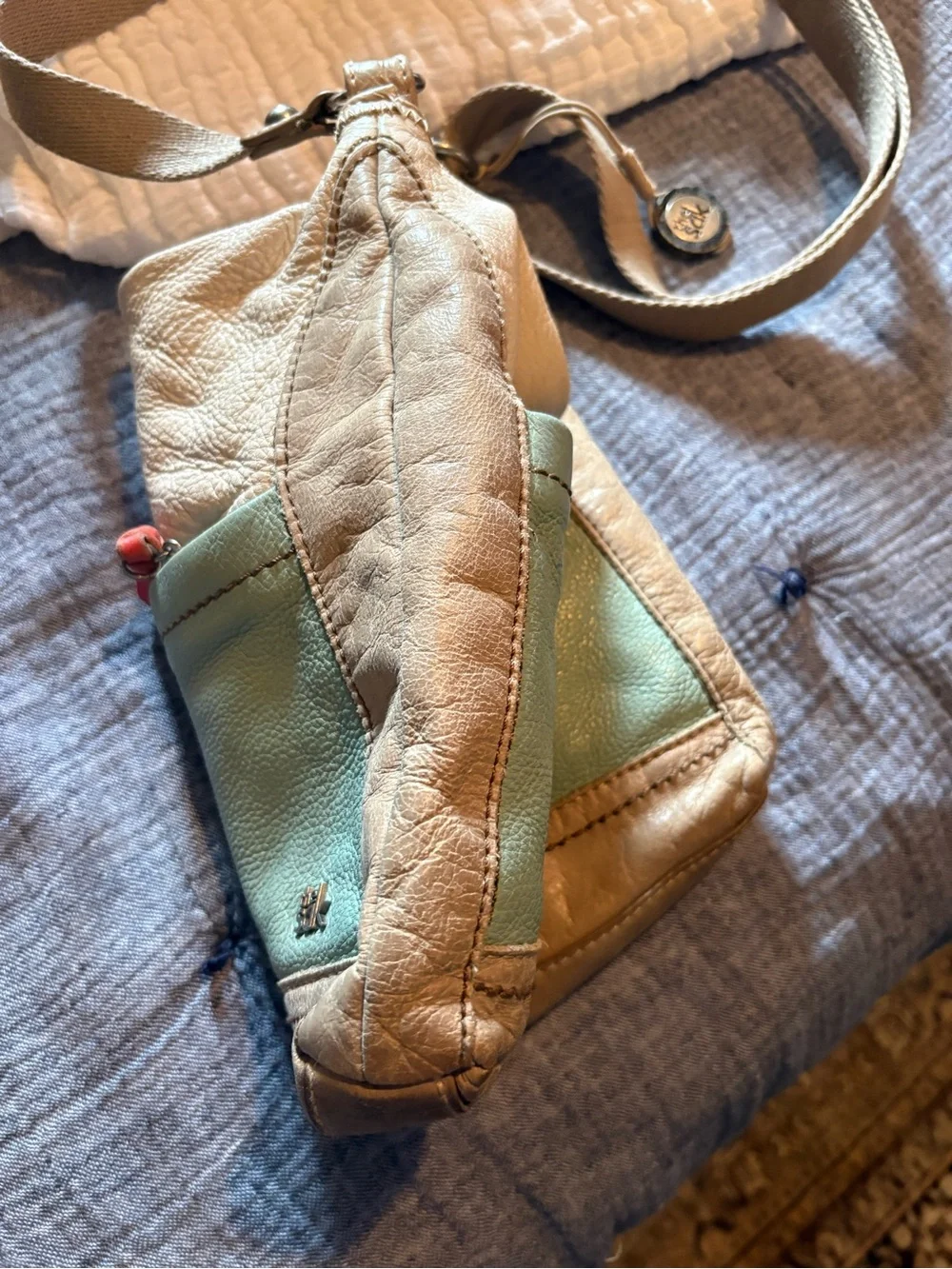 The Sak Beige and Sage Leather Crossbody Bag with Red Accent